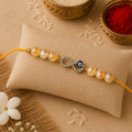 Citrine Evil Eye Infinity Rakhi for Success, Positivity & Protection